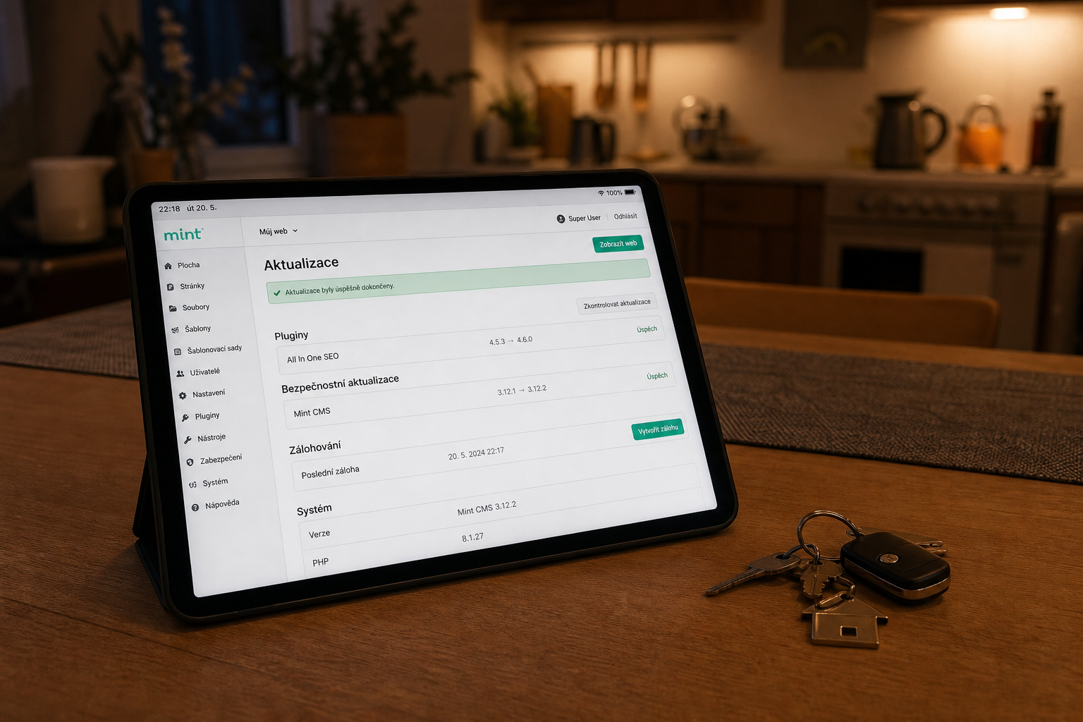 iPad s administrací webu na kuchyňském stole